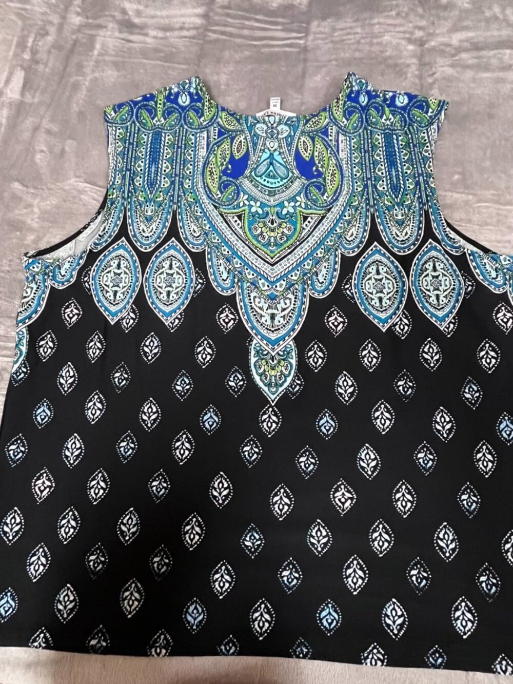 Black with accents of blues, white tank top
